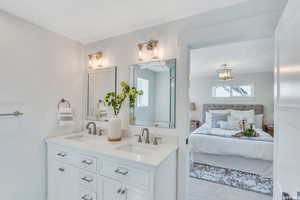 Ensuite bathroom featuring double vanity