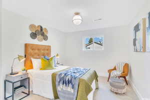 Carpeted bedroom with baseboards