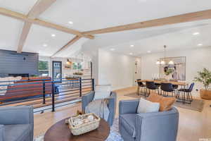 Living area featuring light wood-style floors and recessed lighting