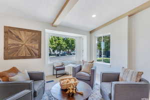 Living area with plenty of natural light, recessed lighting, and a textured ceiling