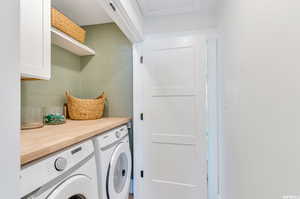 Washroom with washing machine and dryer