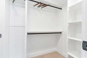 Spacious closet featuring carpet flooring