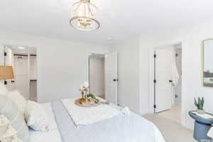 Carpeted bedroom with ensuite bath