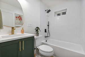 Bathroom with vanity and shower / bathtub combination