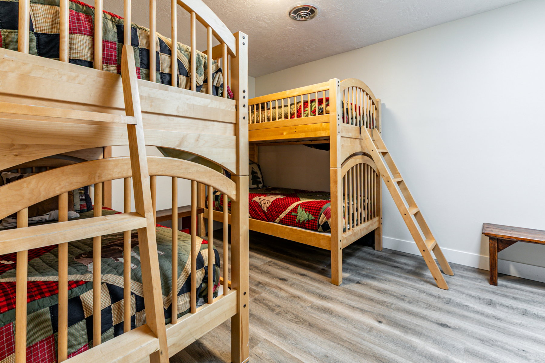 Bedroom with wood finished floors and a textured ceiling