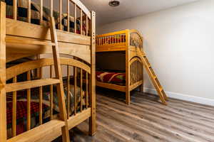 Bedroom featuring a textured ceiling and wood finished floors