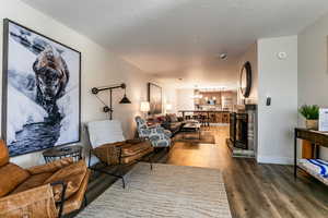 Living room featuring a textured ceiling and wood finished floors