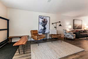 Living area featuring wood finished floors and baseboards