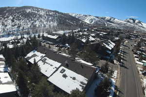 Snowy aerial view with a mountain view