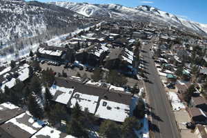 Snowy aerial view with a mountain view