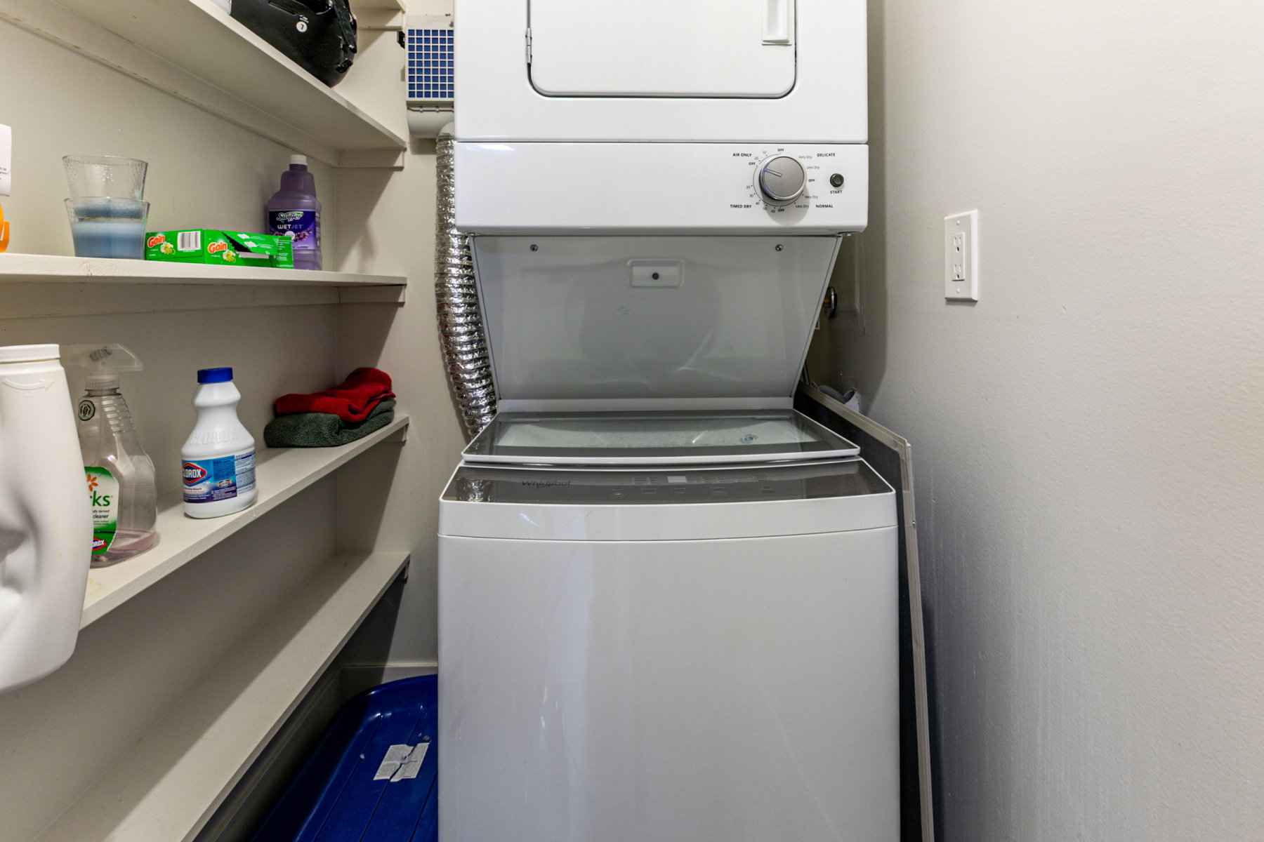 Laundry area featuring stacked washer / dryer