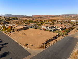 Aerial perspective of suburban area featuring a mountain backdrop