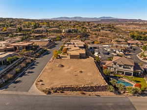 Aerial view of residential area featuring mountains
