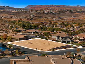 Aerial perspective of suburban area with a mountainous background