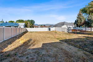View of fenced backyard