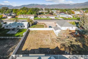 Aerial view of residential area featuring a mountain backdrop