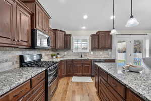 Gas stove and built-in range hood ventilation.