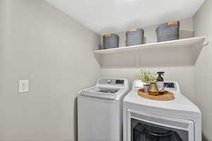 Laundry area featuring independent washer and dryer.