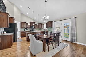 Natural light, dining space, luxurious woodwork.