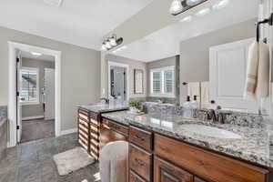 Double-vanity with granite counter tops.