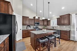 Stainless steel appliances, granite countertops.