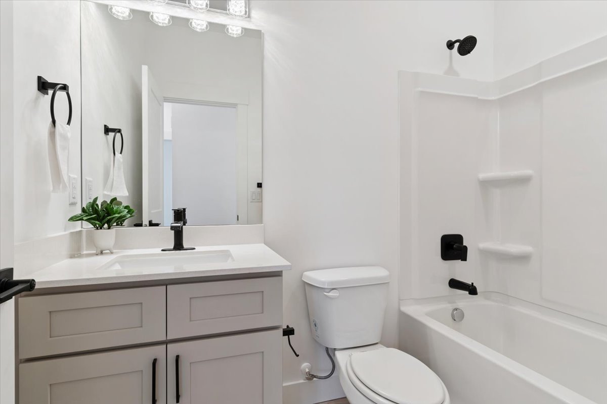 Full bath featuring  shower combination and vanity