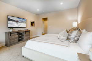Bedroom featuring light carpet and recessed lighting