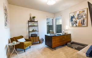 Office area featuring light colored carpet