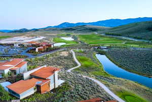 Bird's eye view of a local golf course and a water and mountain view
