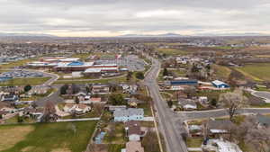 View of property location with a mountain backdrop and nearby suburban area