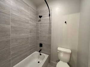Full bath with shower / tub combination and toilet