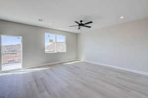 Empty room featuring light wood finished floors, recessed lighting, and ceiling fan