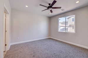 Unfurnished room featuring a ceiling fan, recessed lighting, and light carpet