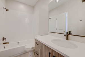 Bathroom featuring vanity and bathing tub / shower combination