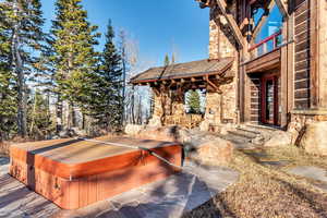 View of patio featuring a hot tub