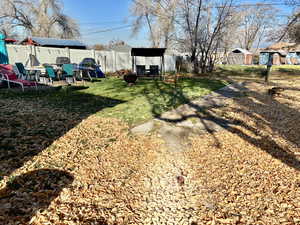 Fenced backyard featuring a patio