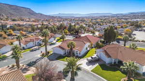 Aerial view of residential area featuring a mountain backdrop