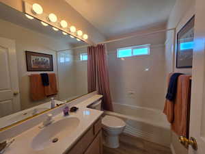 Full bath featuring vanity, shower / bathtub combination
