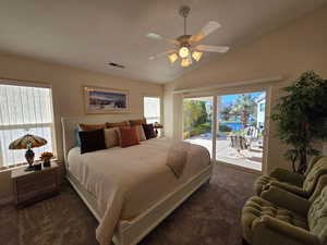 Master bedroom with sliding glass door to back patio and views of water feature and mountains.