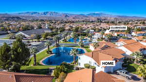 Aerial view of residential area featuring mountains