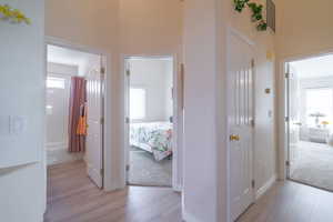Hallway featuring light wood-style floors