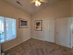 3rd bedroom/den with double doors and another single door featuring new carpet
