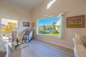 Sitting room with NEW LVP floors and baseboards and VIEWS from the Window