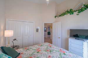 2nd Bedroom with a high ceiling and a closet