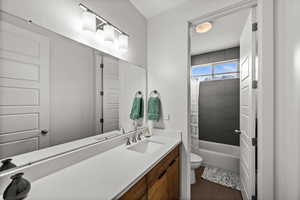 Full bath featuring vanity and shower / bath combo