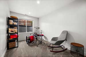 Recreation room with carpet flooring and baseboards