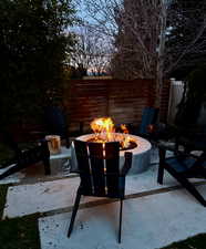 View of patio featuring an outdoor fire pit