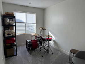 Bedroom with carpet flooring and a textured ceiling
