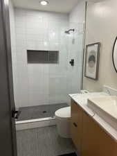 Bathroom with vanity and a stall shower
