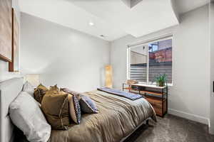 Bedroom featuring dark colored carpet and recessed lighting